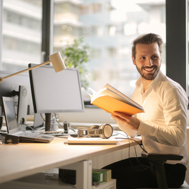 Person Smiling at Desk